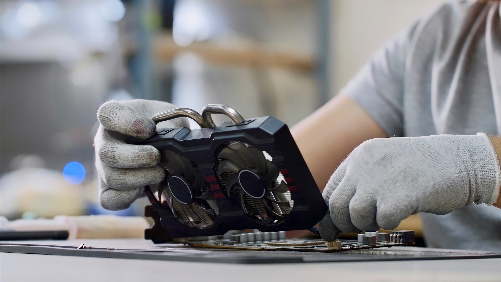 Repairman is fixing the graphics chipset, close-up